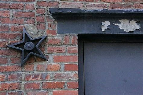 black metal star on house meaning|metal stars on old buildings.